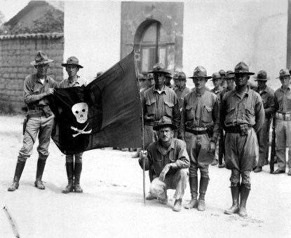 U.S. Marines holding Sandino's battle flag - Nicaragua, 1932.
